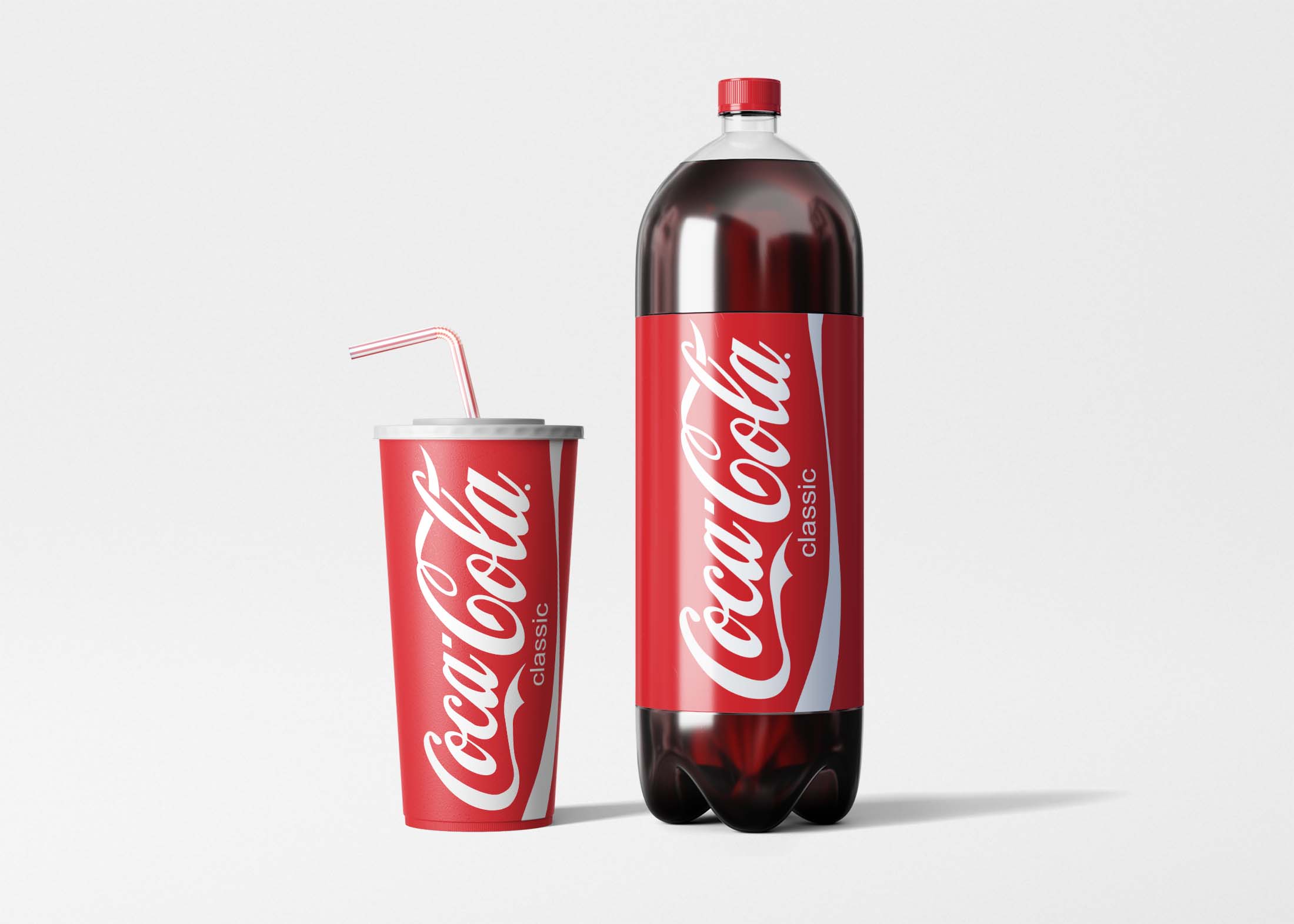 A large plastic bottle and a cup of Coca-Cola, both featuring the iconic red and white branding, are displayed together.