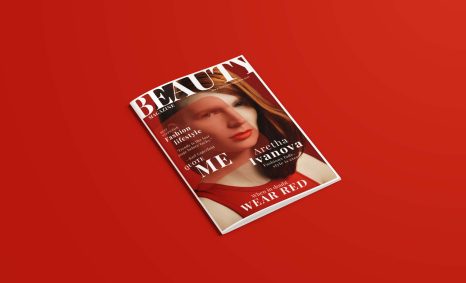 A magazine cover features a woman with red lipstick and long hair, set against a vibrant red background.
