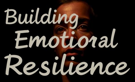 A dimly lit face gazes thoughtfully, with the words "Building Emotional Resilience" prominently displayed.