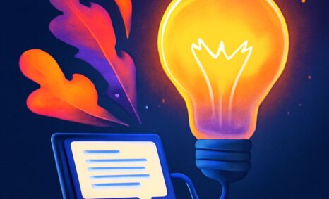 A glowing light bulb emerges from a laptop, surrounded by colorful leaves against a dark background.